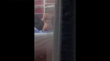 Voyeur Peeping Through Window with MILF undressing on SpyAmateur.com