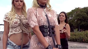 Mistress disgraces two hot blonde slaves in public