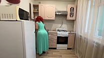 The MILF knelt in front of her son in the kitchen and allowed him to insert a dick in her ass